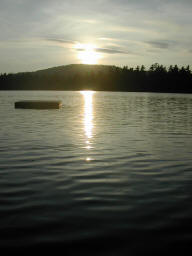 Swimming dock as the sun sets over Buck Hill