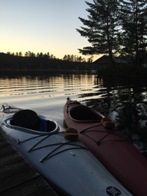 Kayaks await an evening paddle